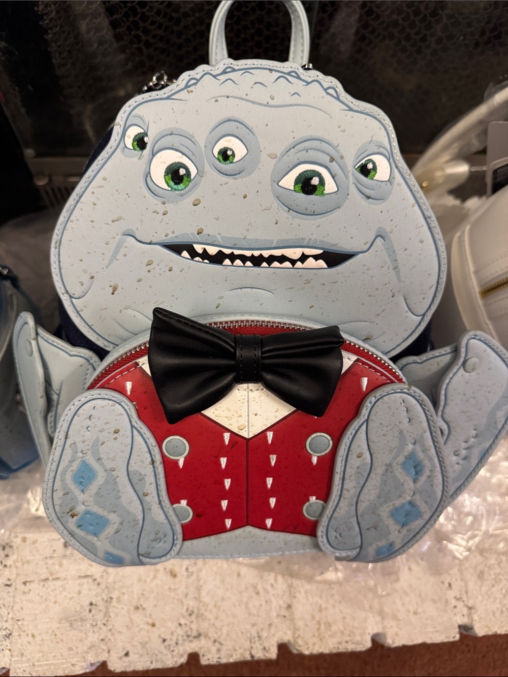 Loungefly Light Blue Multi‑Eye Monster Crossbody with Red Vest and Black Bow